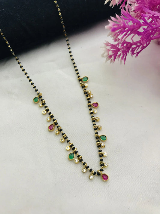 Gold Tanmaniya Mangalsutra With Red And Green Diamonds